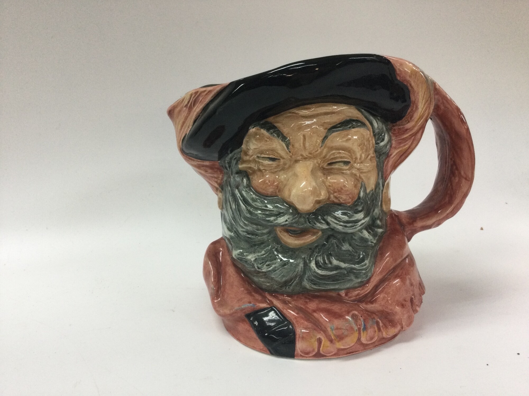 6 large toby jugs featuring : the fireman,sir John falstaff, ugly duchess, regency beau,gunsmith, blacksmith. A great collectors item.