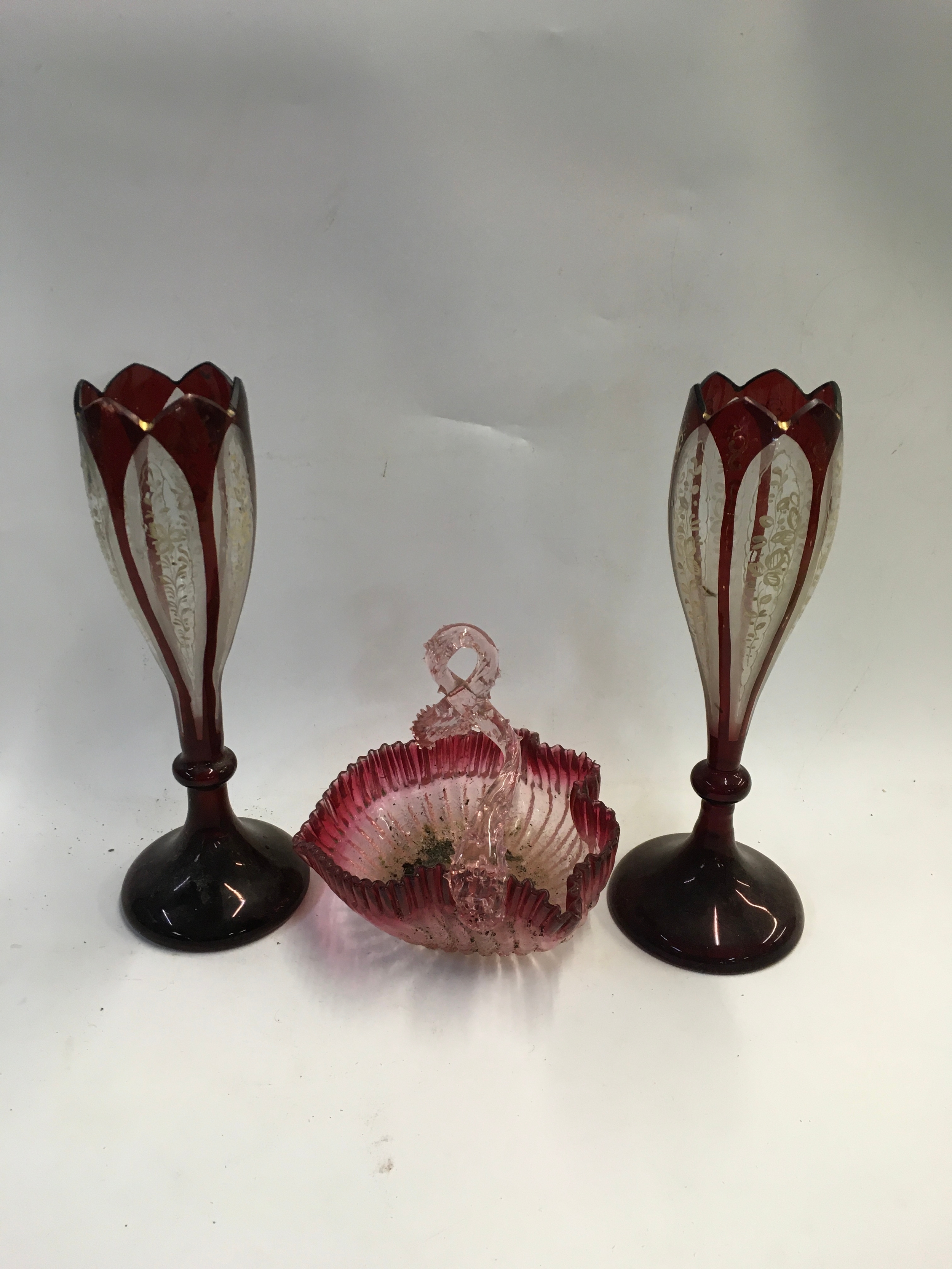 A pair of Victorian ruby overlay Vases and basket glass. 