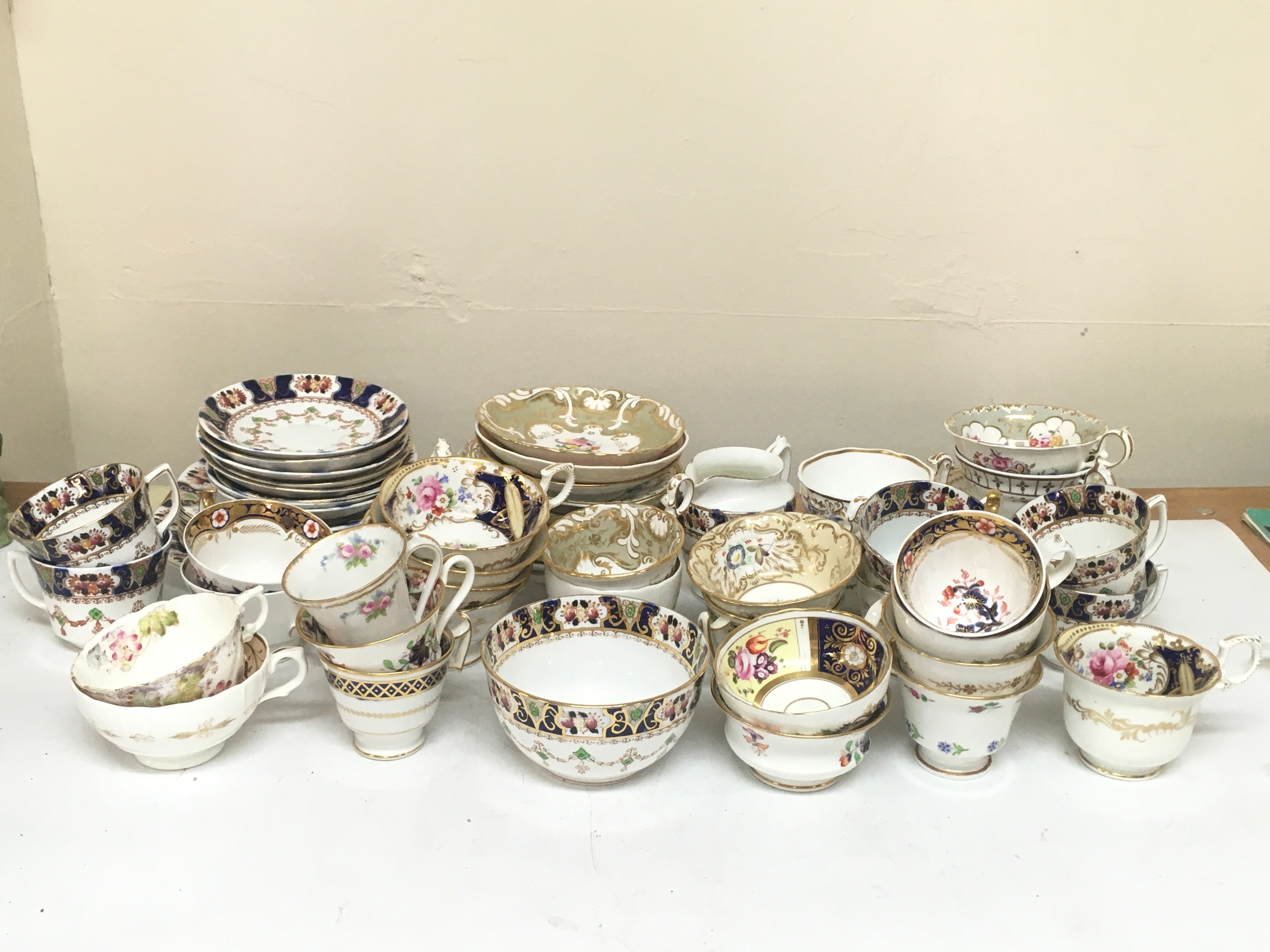 An unmarked decorative part tea set including various designs 