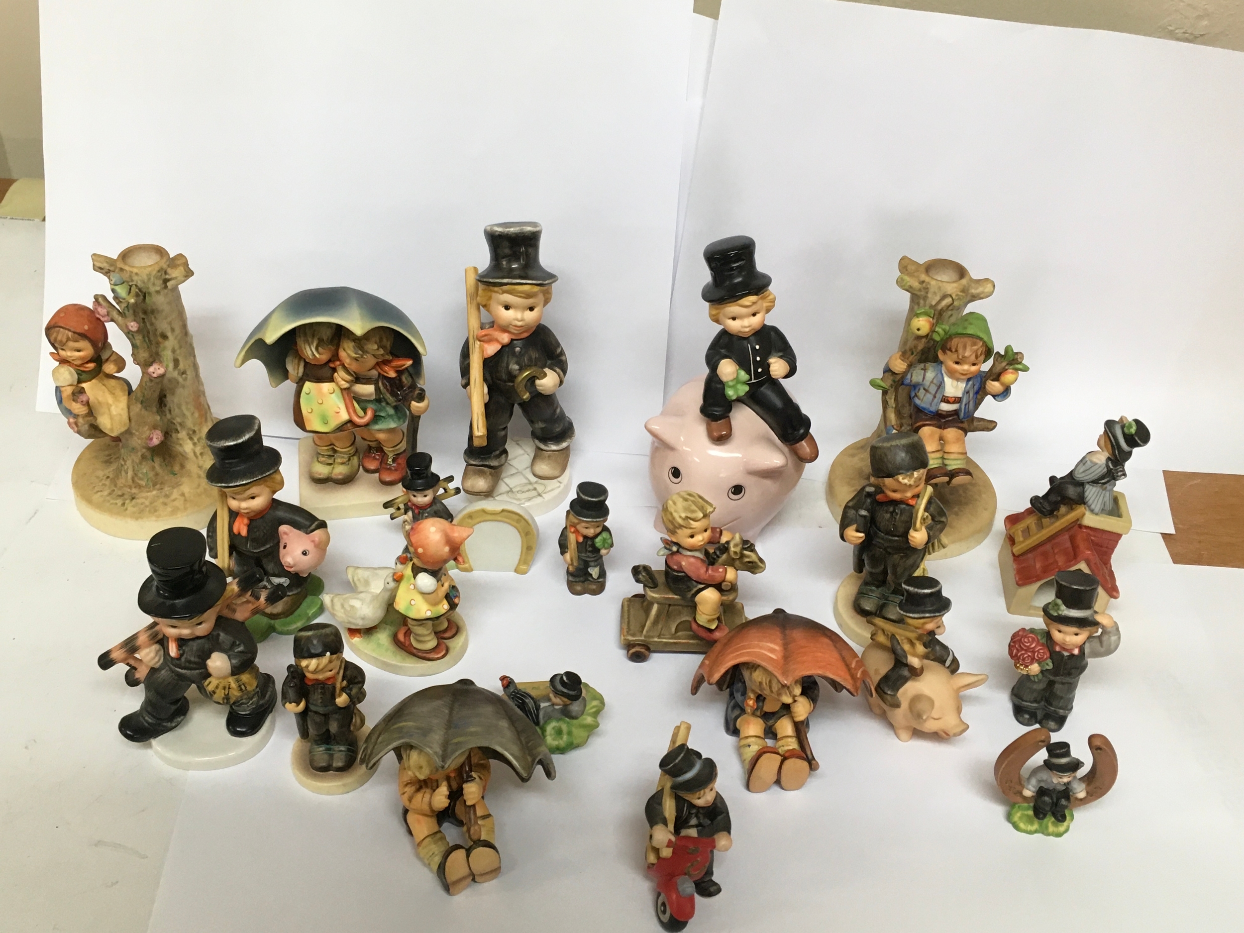 A Collection of 21 Goebel Hummel Figureines.