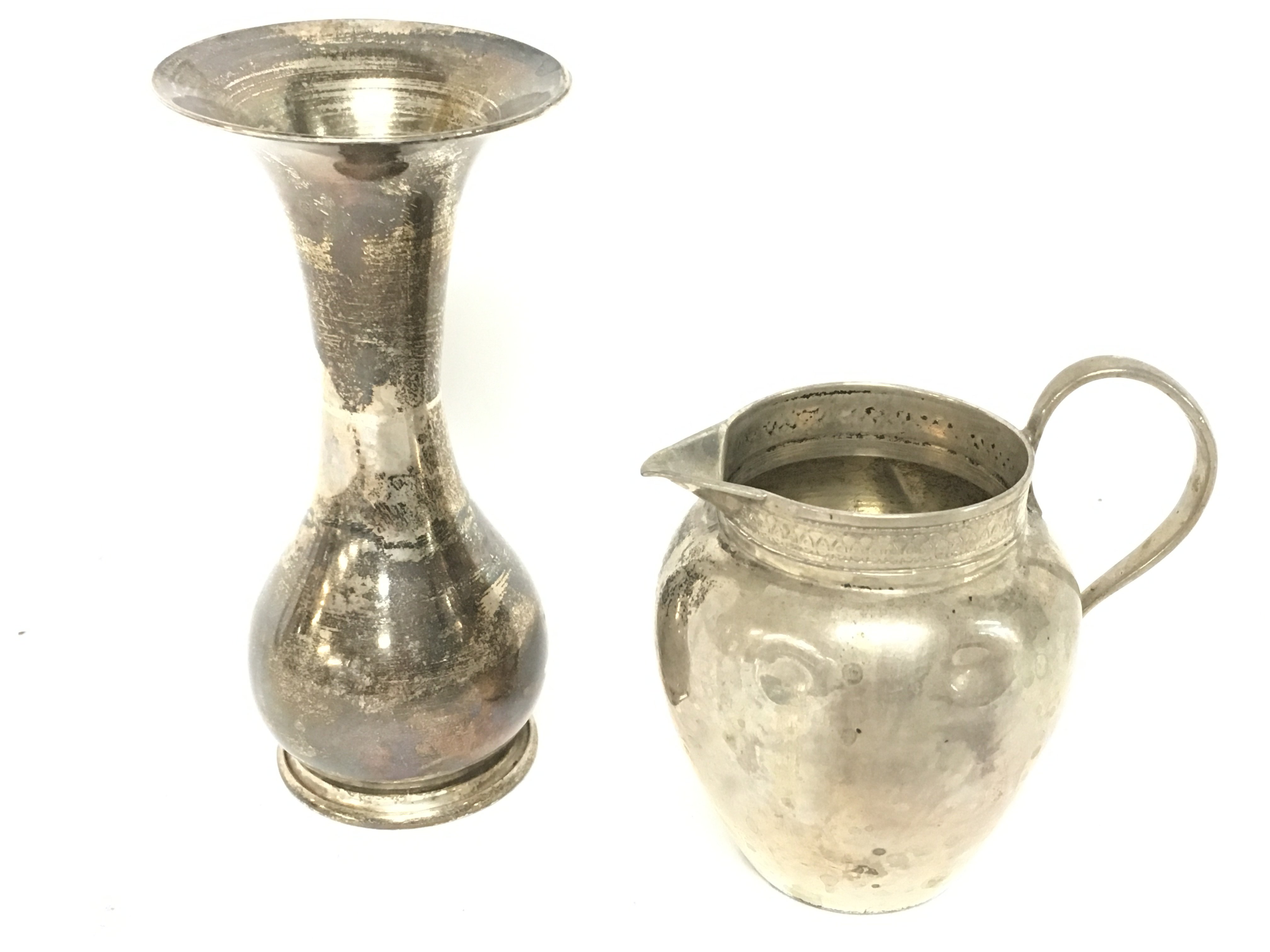 Small silver items consisting of a .800 marked silver jug and an Egyptian hallmarked silver vase , 9.2 & 6cm tall approximately. postage cat B