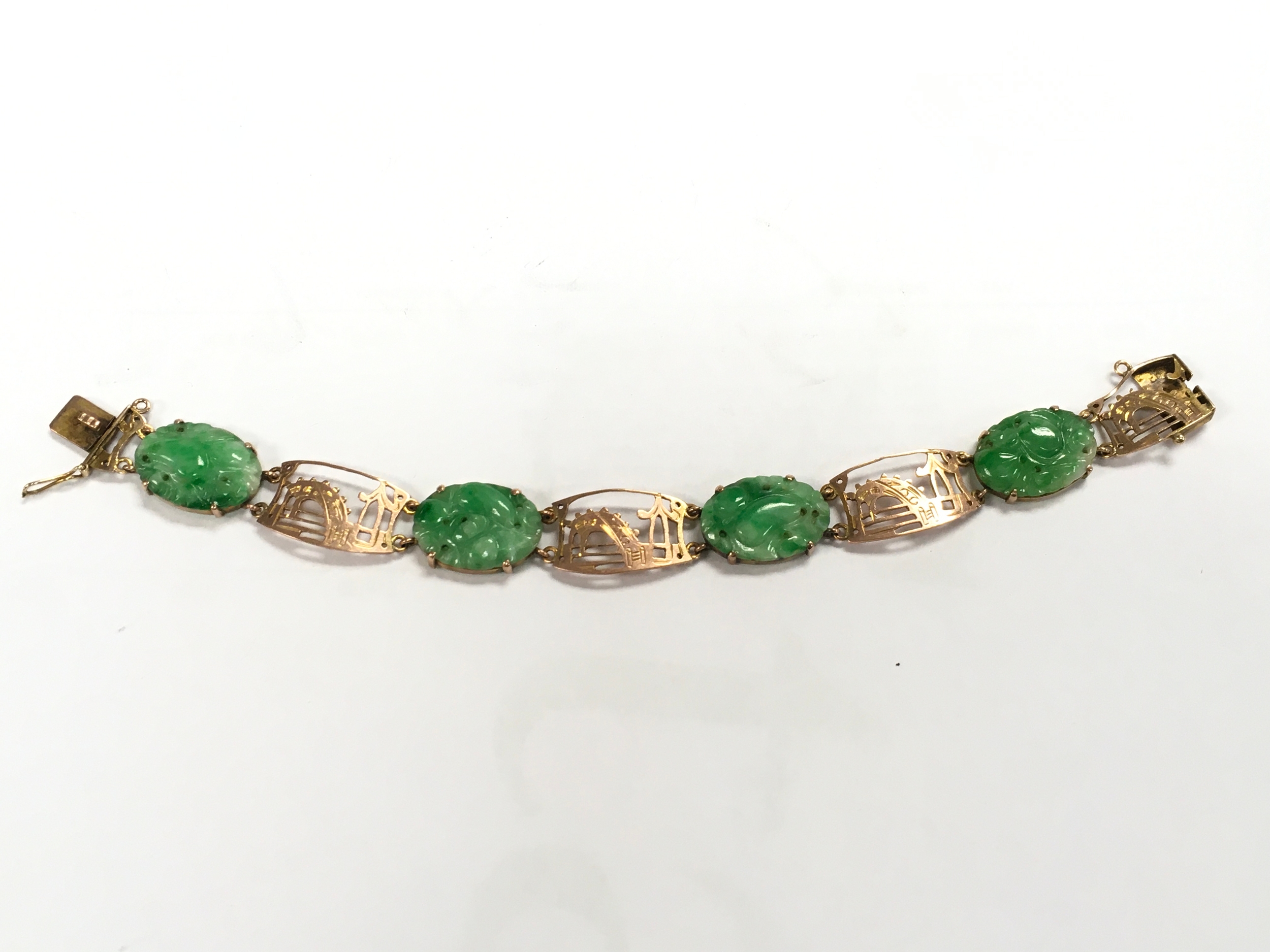 A 9ct Gold jade bracelet, 11.5g total weight. 17cm long 