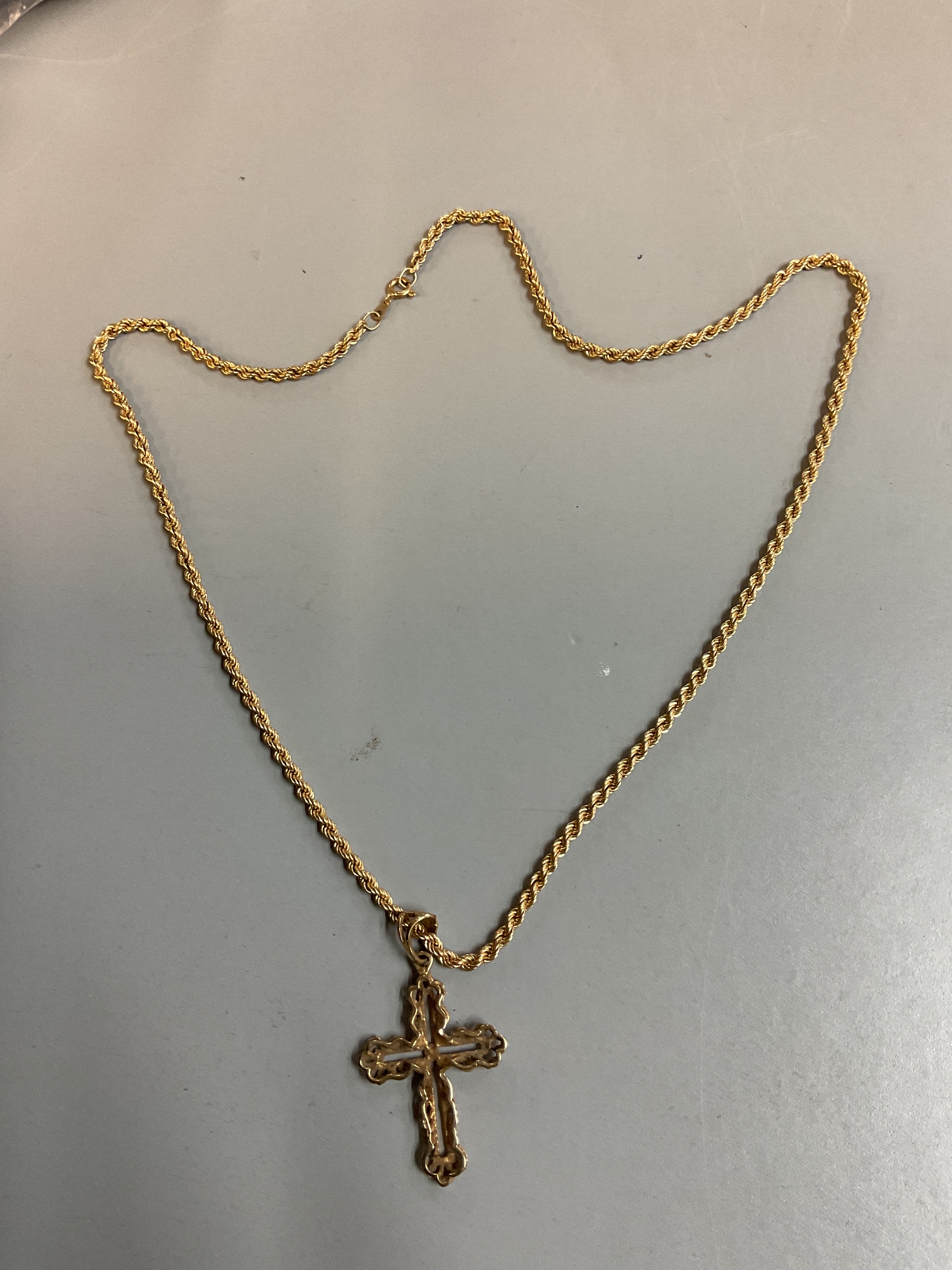 9 ct rope chain with cross pendant, weight 11 grams.