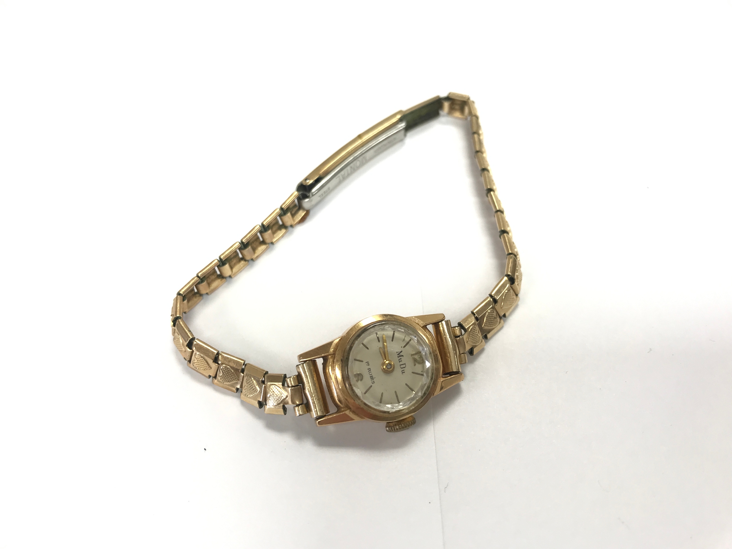 A ladies vintage 18ct gold cased watch. Strap is rolled gold. 11.6g total