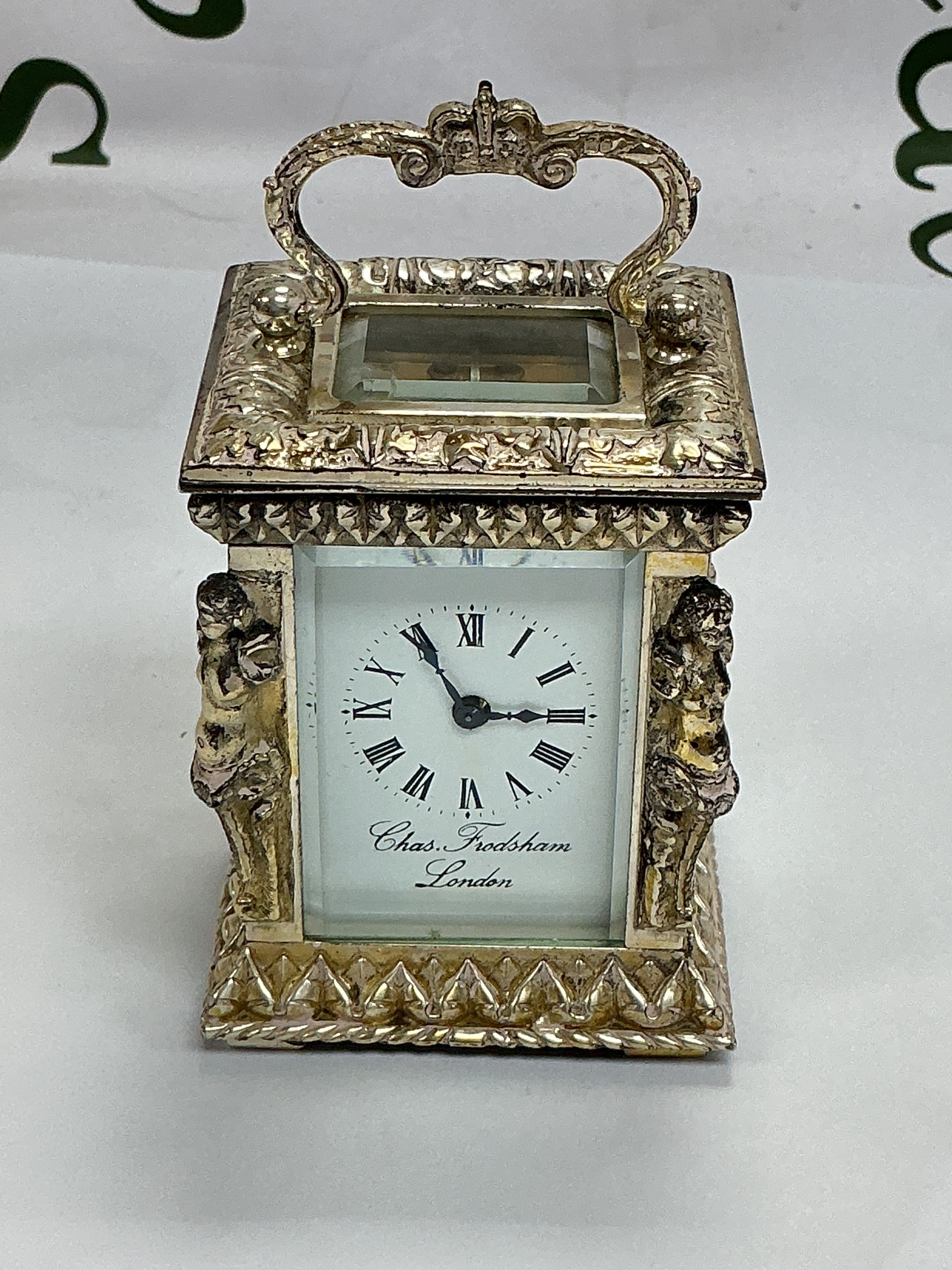 A Charles Frodsham of London five glass silver carriage clock, approx height 8.5cm. Comes with key.