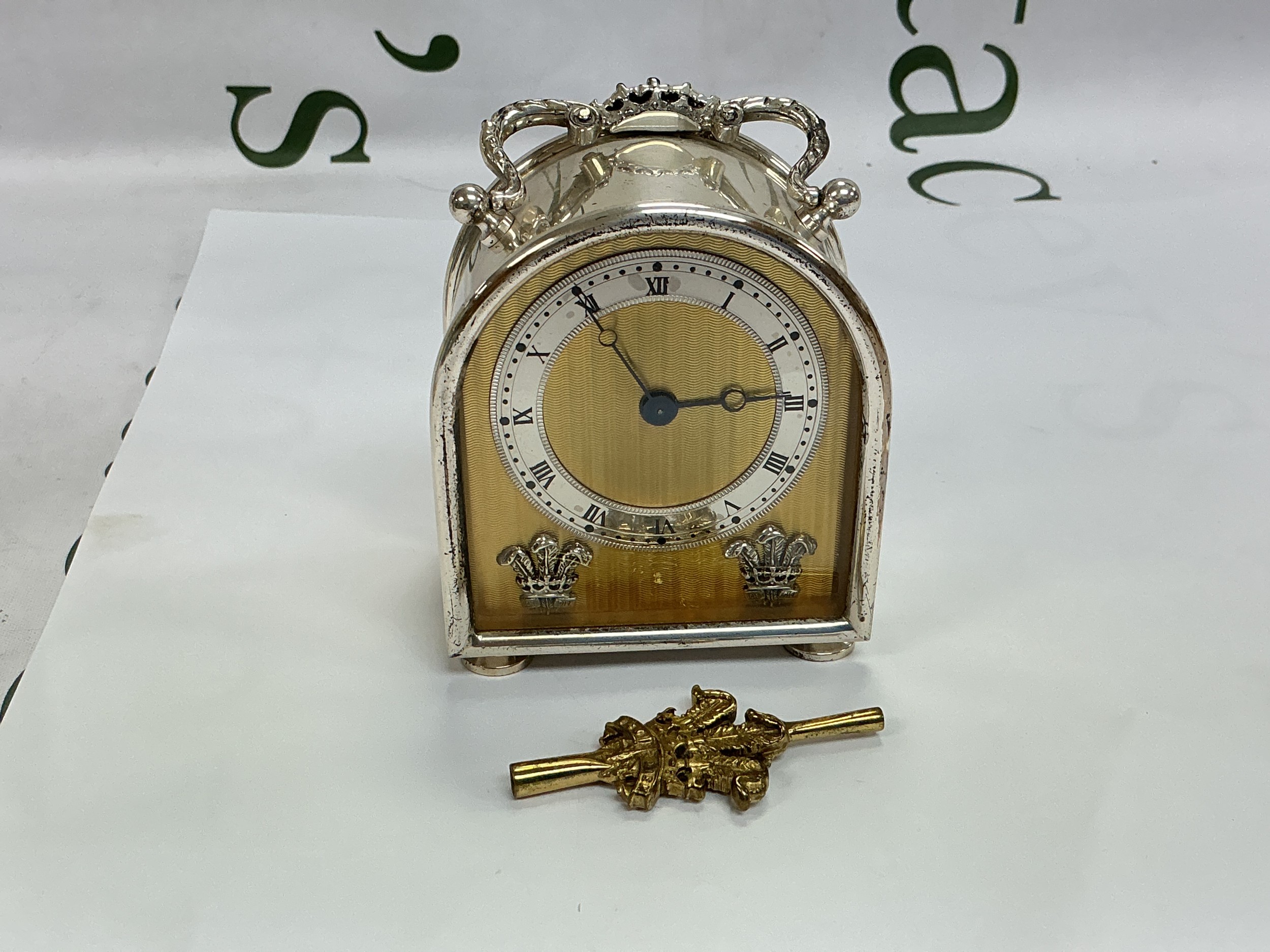 A silver cased carriage clock with flour de Ltd decoration to the dial and inscription to the reverse for the 1981 royal wedding of HRH Charles and Diana Spencer. Comes with key. Approx height 9cm.