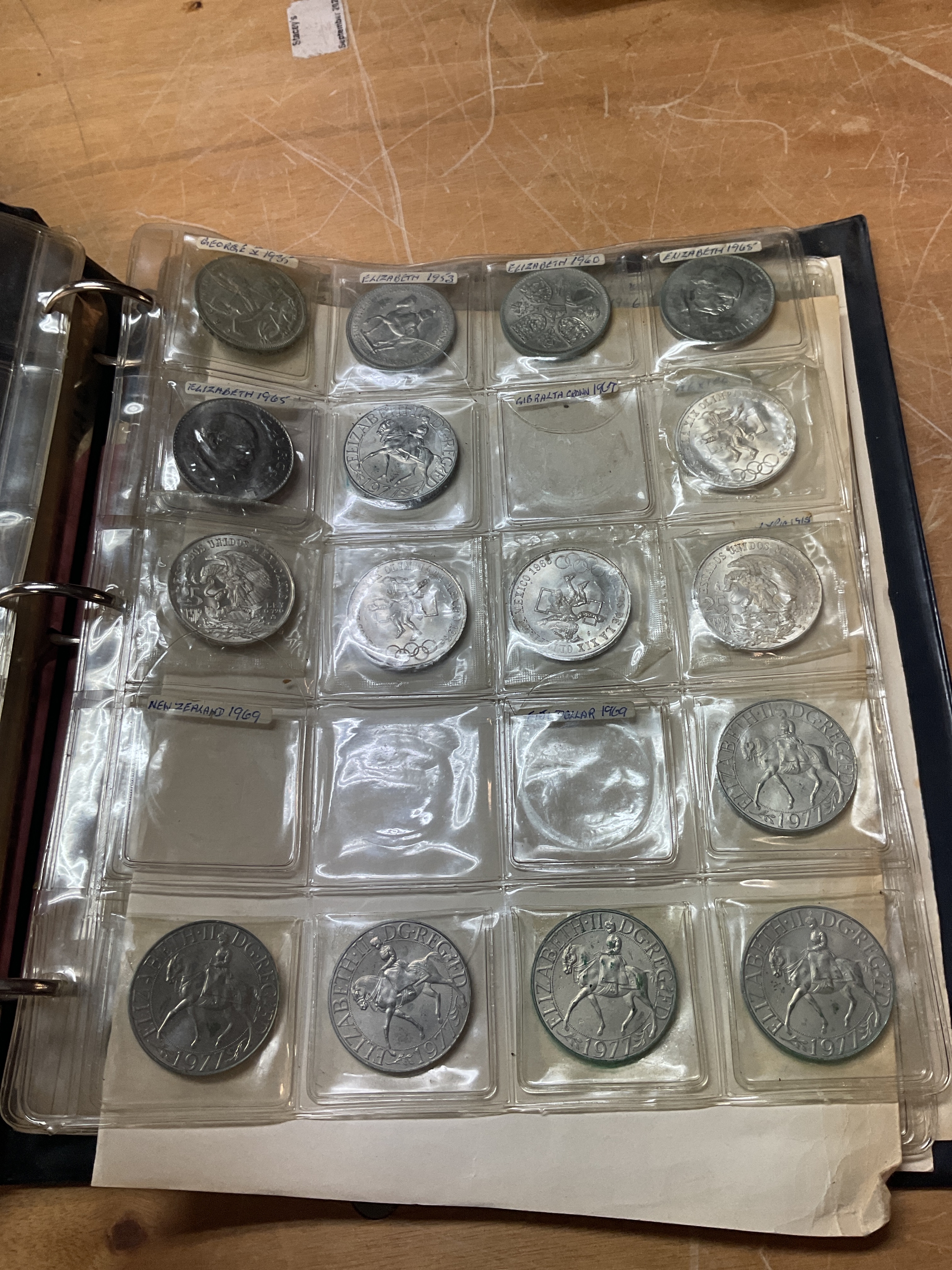 Coin album with rocking horse crown, foreign silver crowns and others.
