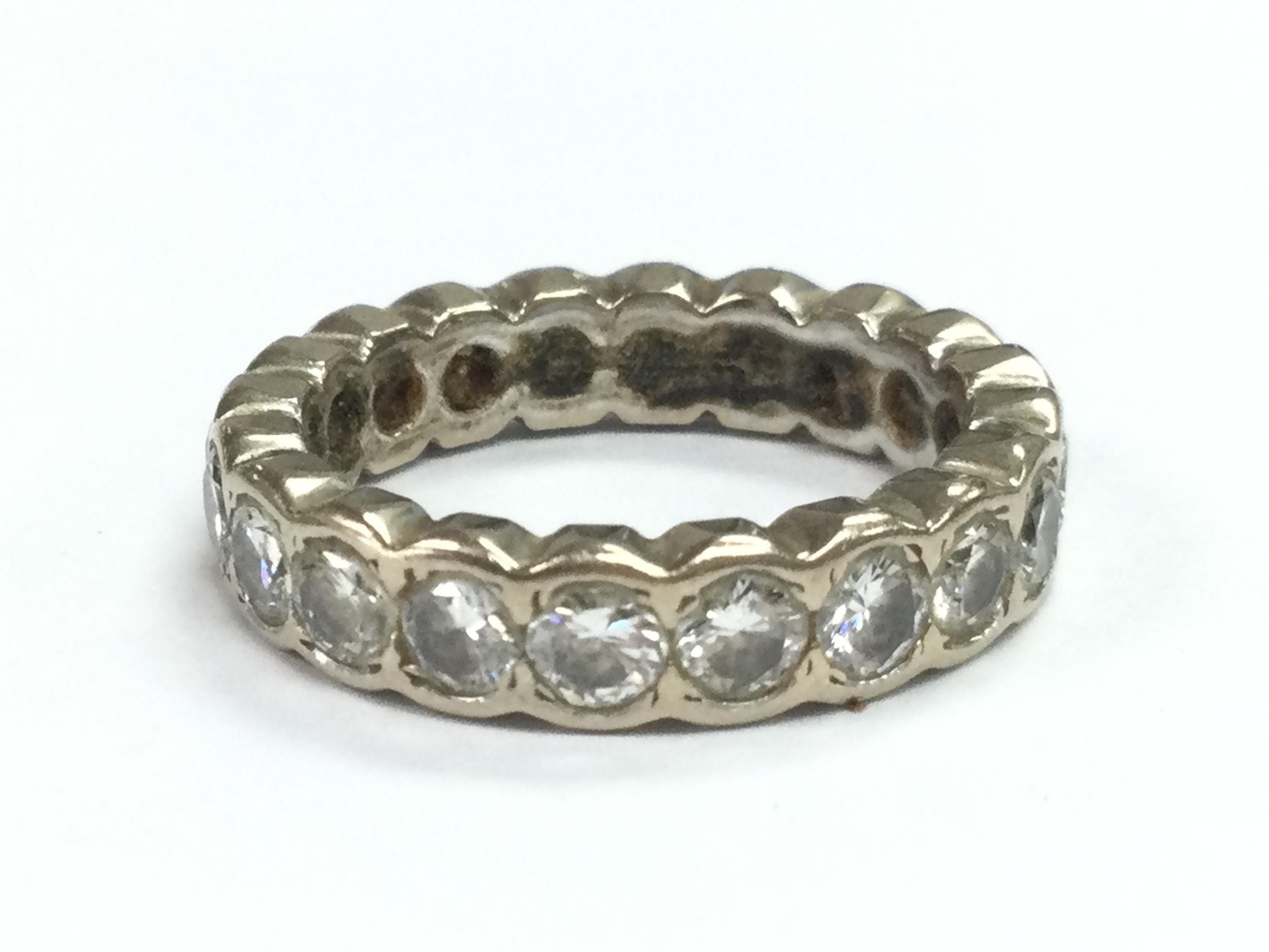 Platinum/ white gold unmarked diamond set eternity ring , size J, 5.1g total weight
