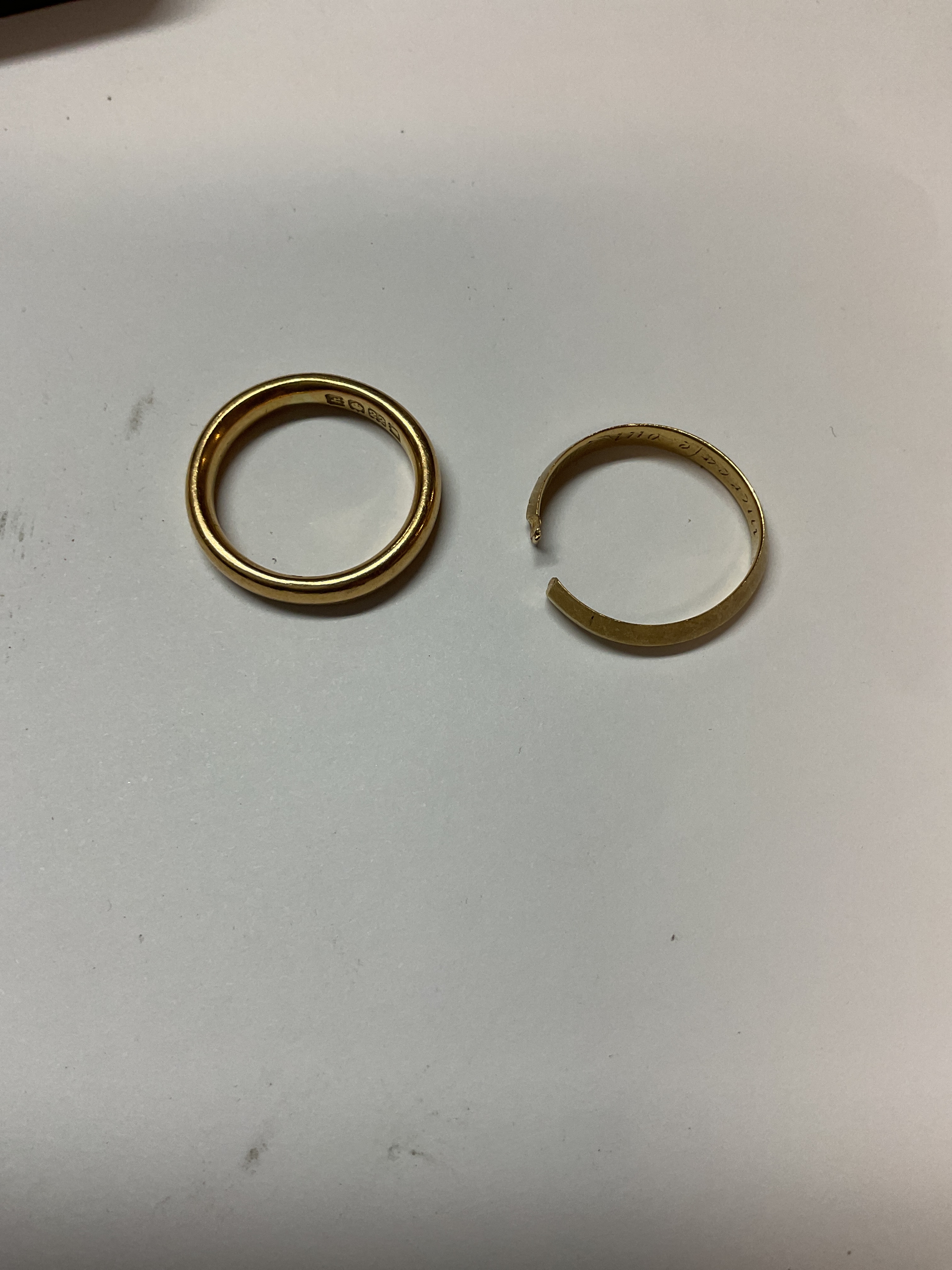 Hallmarked 22 ct ring and one other which has been cut, weight 7.5 grams and 3 grams.