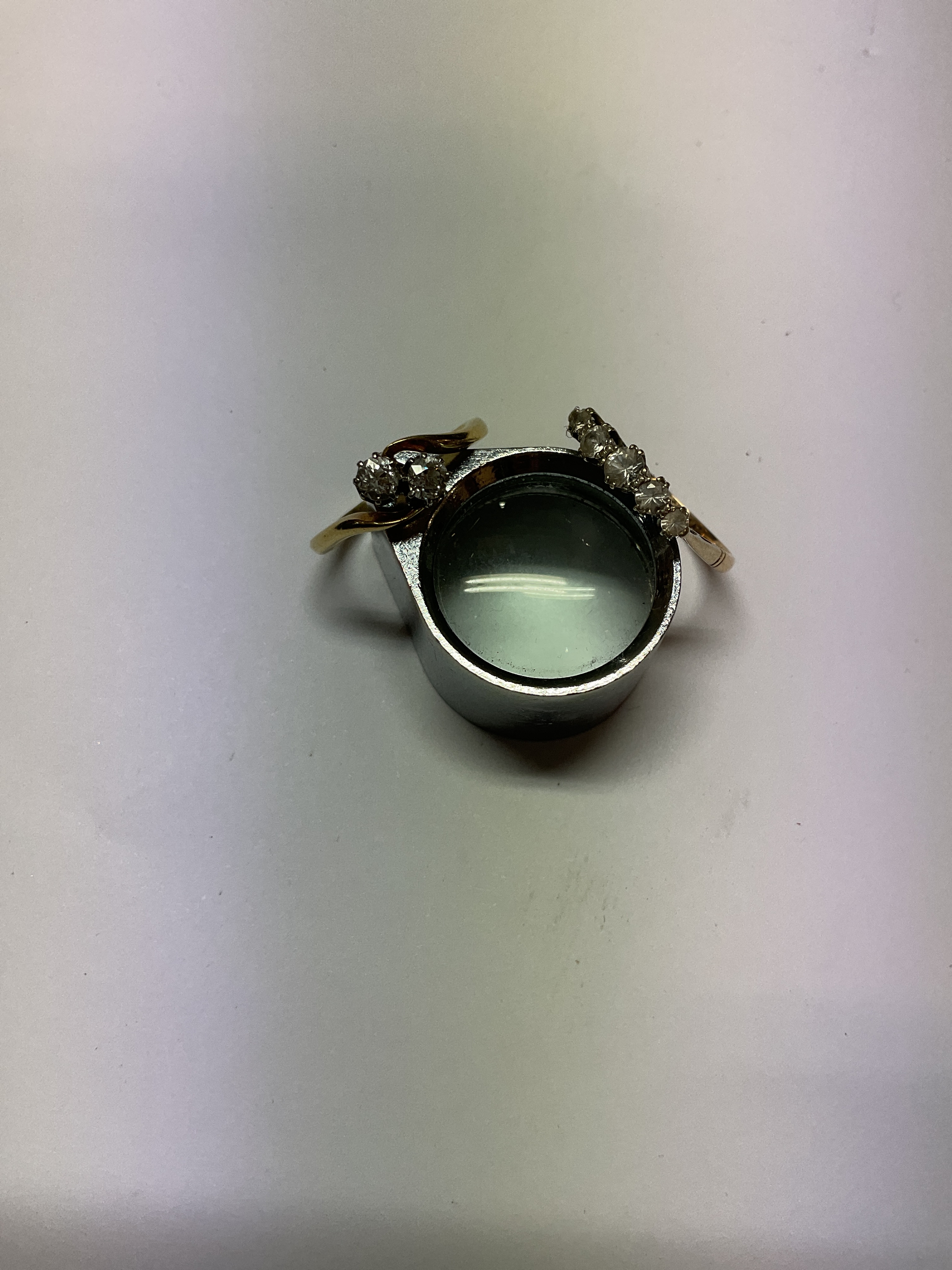 18 ct diamond crossover ring approx half carat total old cut stones by spread weight, along with 9 ct and platinum CZ set five stone ring.weight 2.8 grams and 1.7 grams.