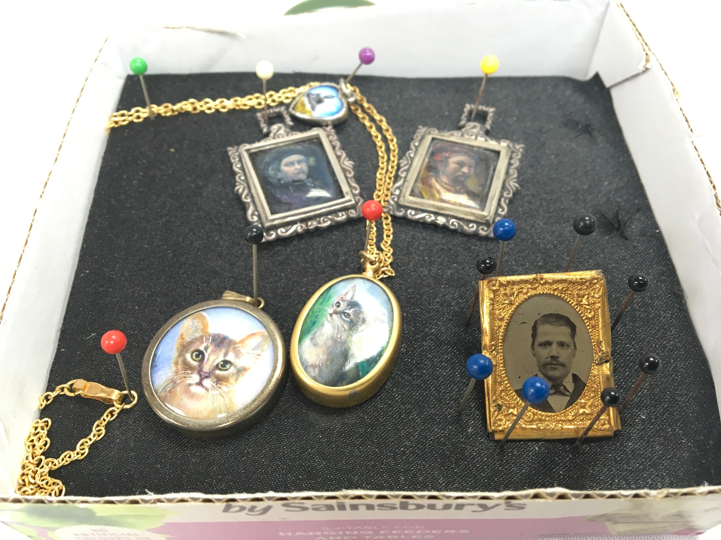 Five various small miniature pendants and a small photo . No reserve 