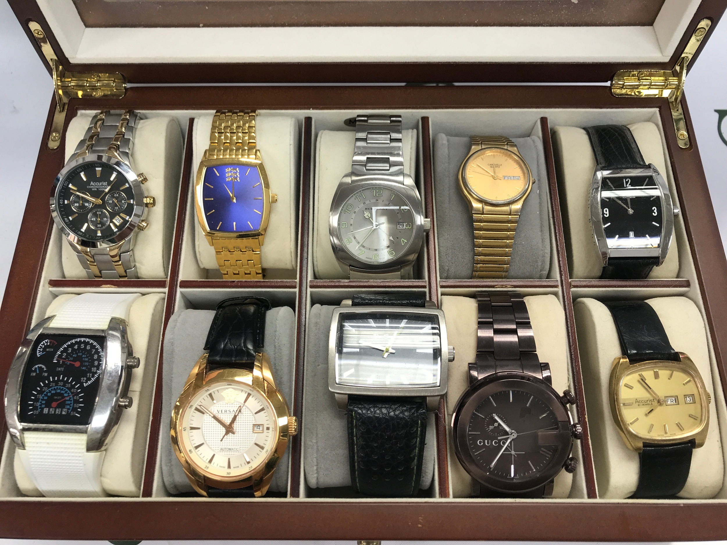 A collection of 10 assorted watches including Accurist Gucci etc comes with a 10 watch box.