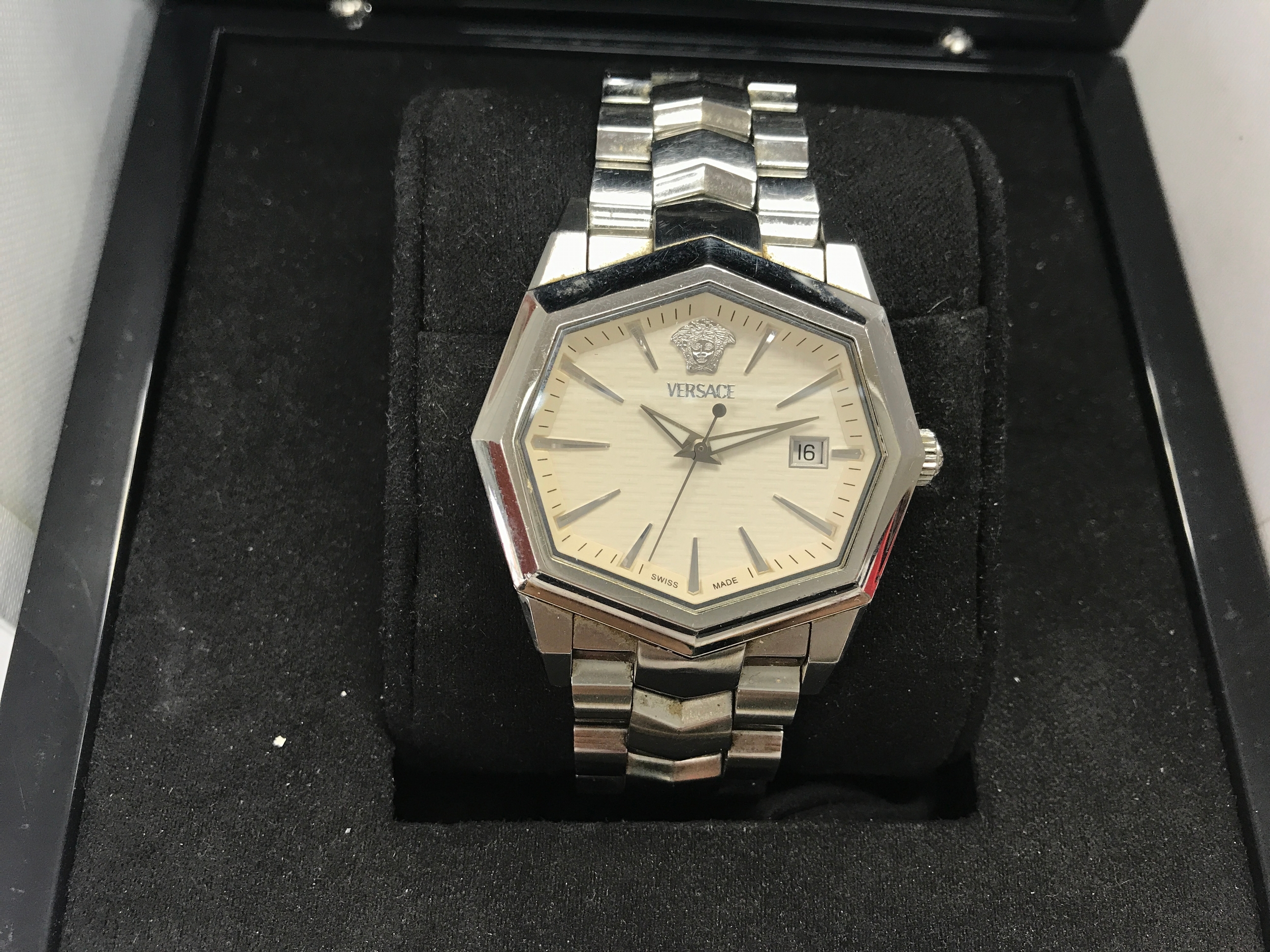 stainless steel Versace Atelier quartz watch featuring a distinctive geometric octagonal case and the iconic Medusa head. Comes with box and card.