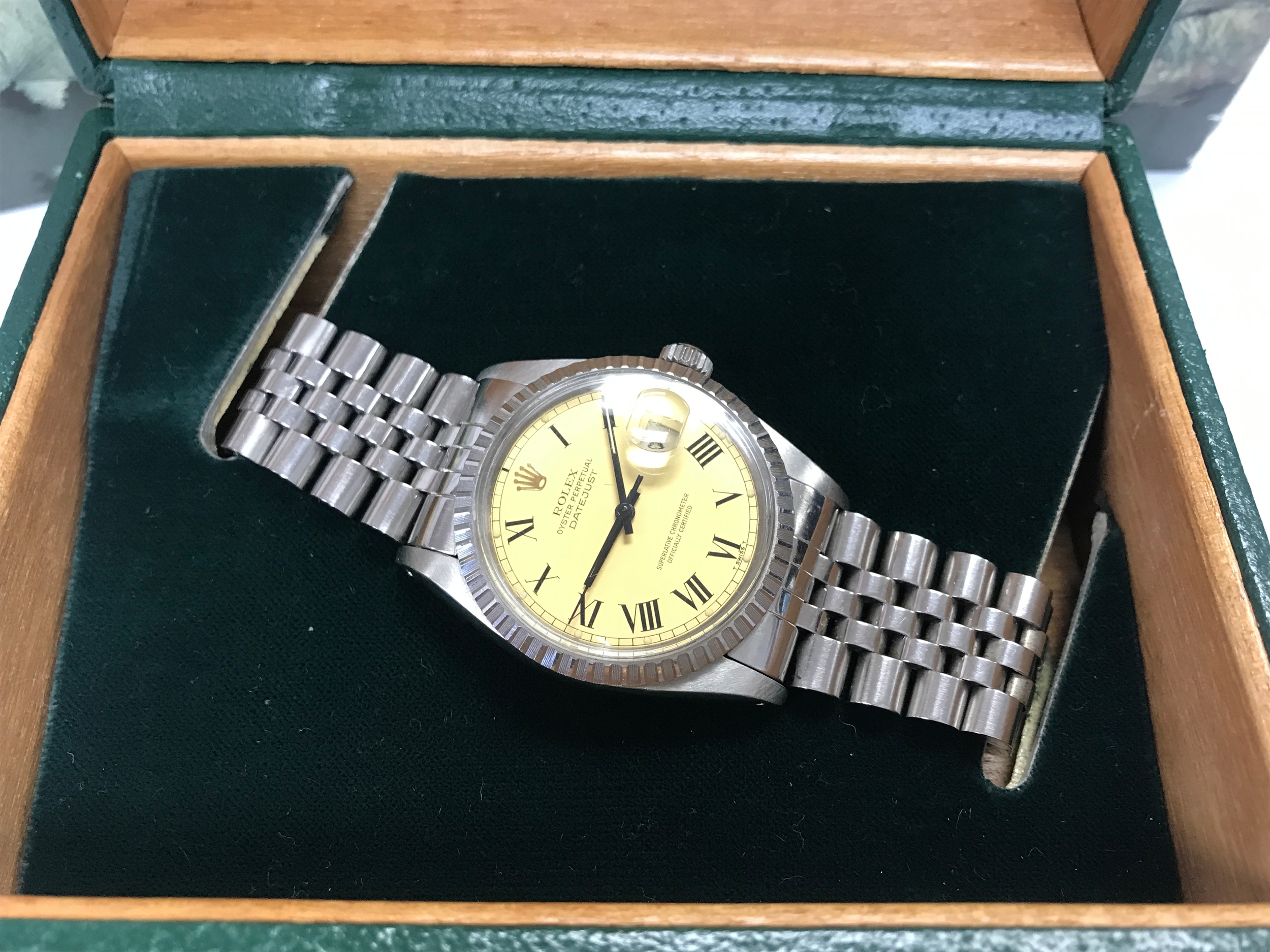 Rolex Datejust 36 reference 16030 featuring a champagne "Buckley" dial with painted Roman numerals and a stainless steel Jubilee bracelet. Comes with box and papers. Winds and seen running. Circa 1984