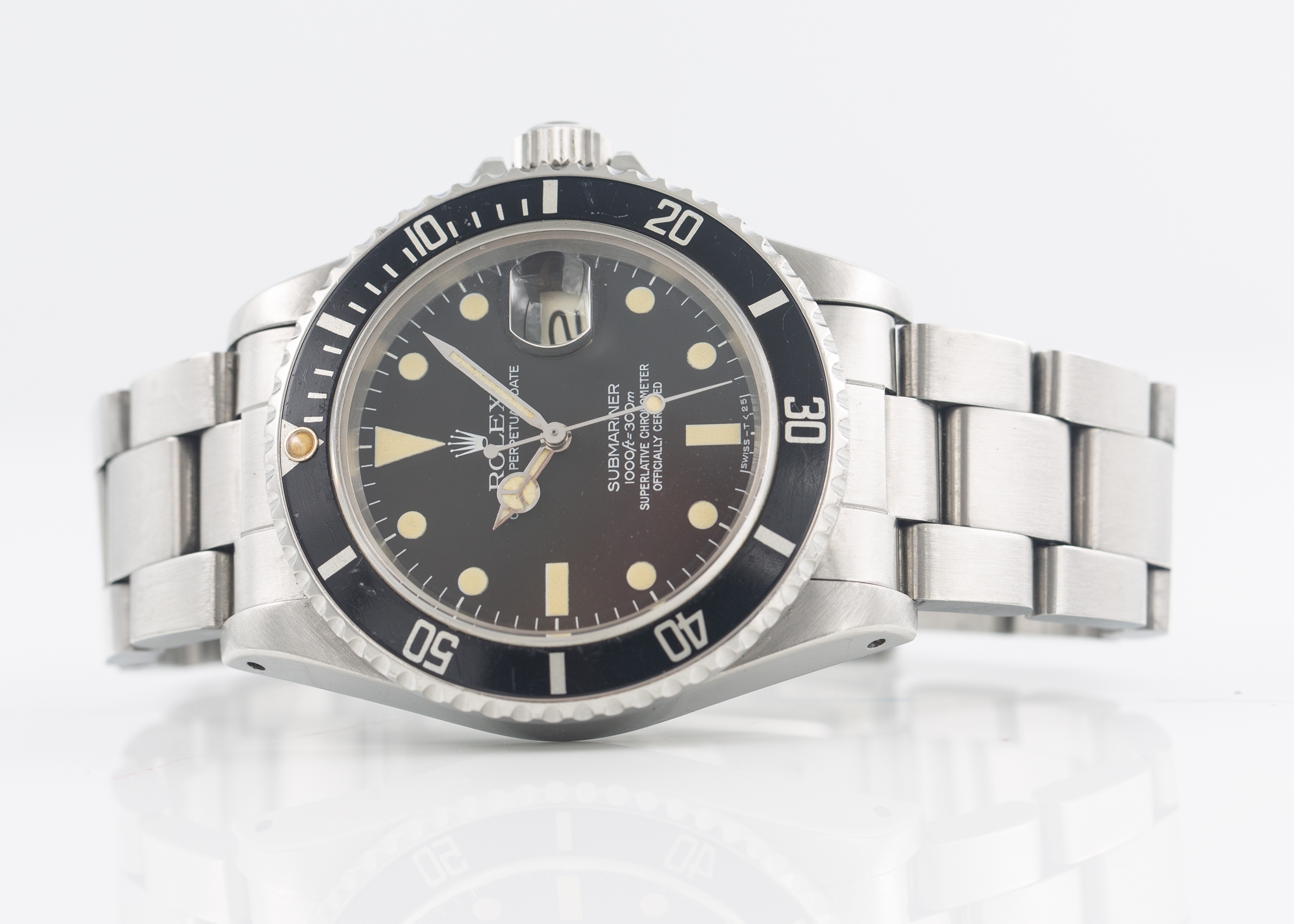 Rolex Submariner Date Reference 1680 black dial with tritium hour markers which have a lovely patina. Comes with box, anchor and service paperwork from November 2022. Winds and runs. Circa 1983.