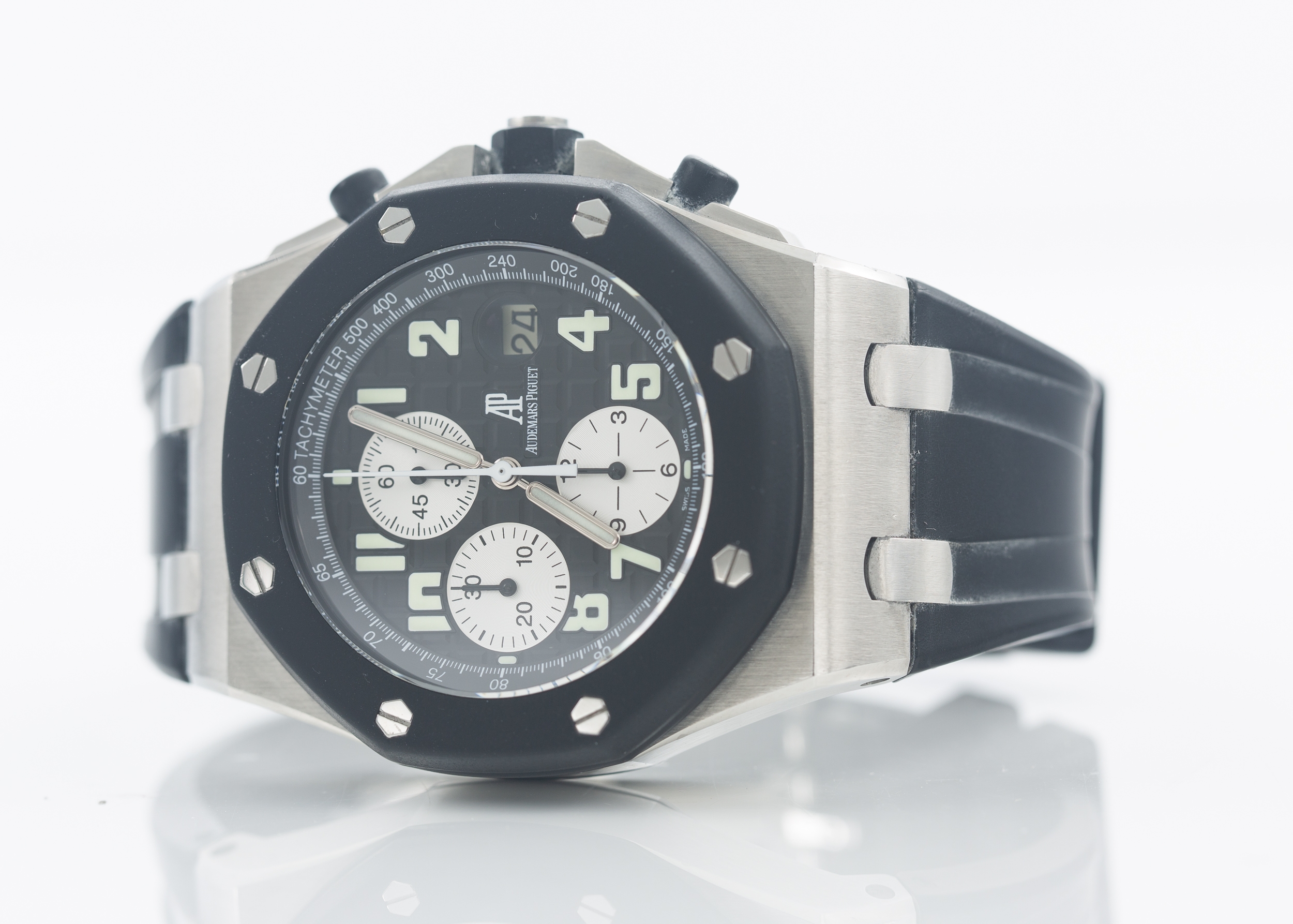 Audemars Piguet Royal Oak Offshore Chronograph. Stainless steel measuring 42 mm across. Black textured face with white sub-dials and bold Arabic numbers. Box and Manual. Wind and runs.