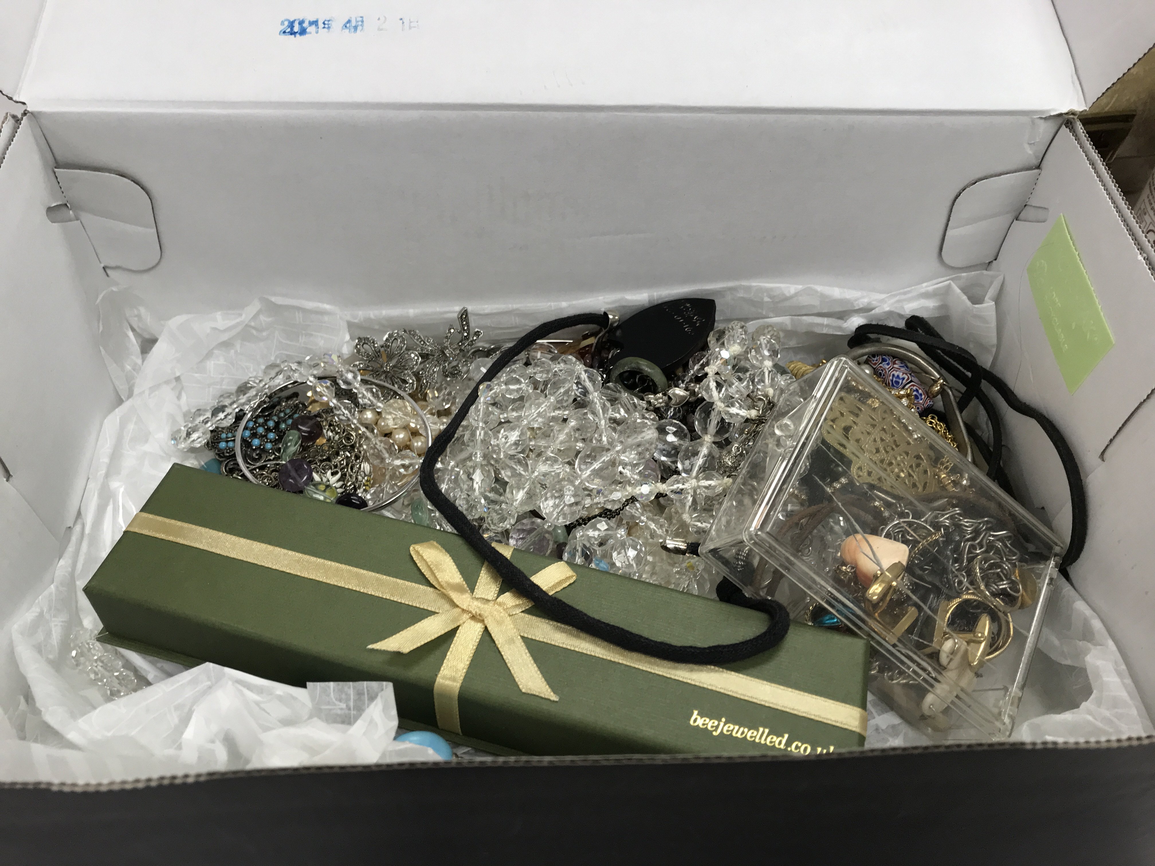 A box of jewellery including costume & some silver jewellery