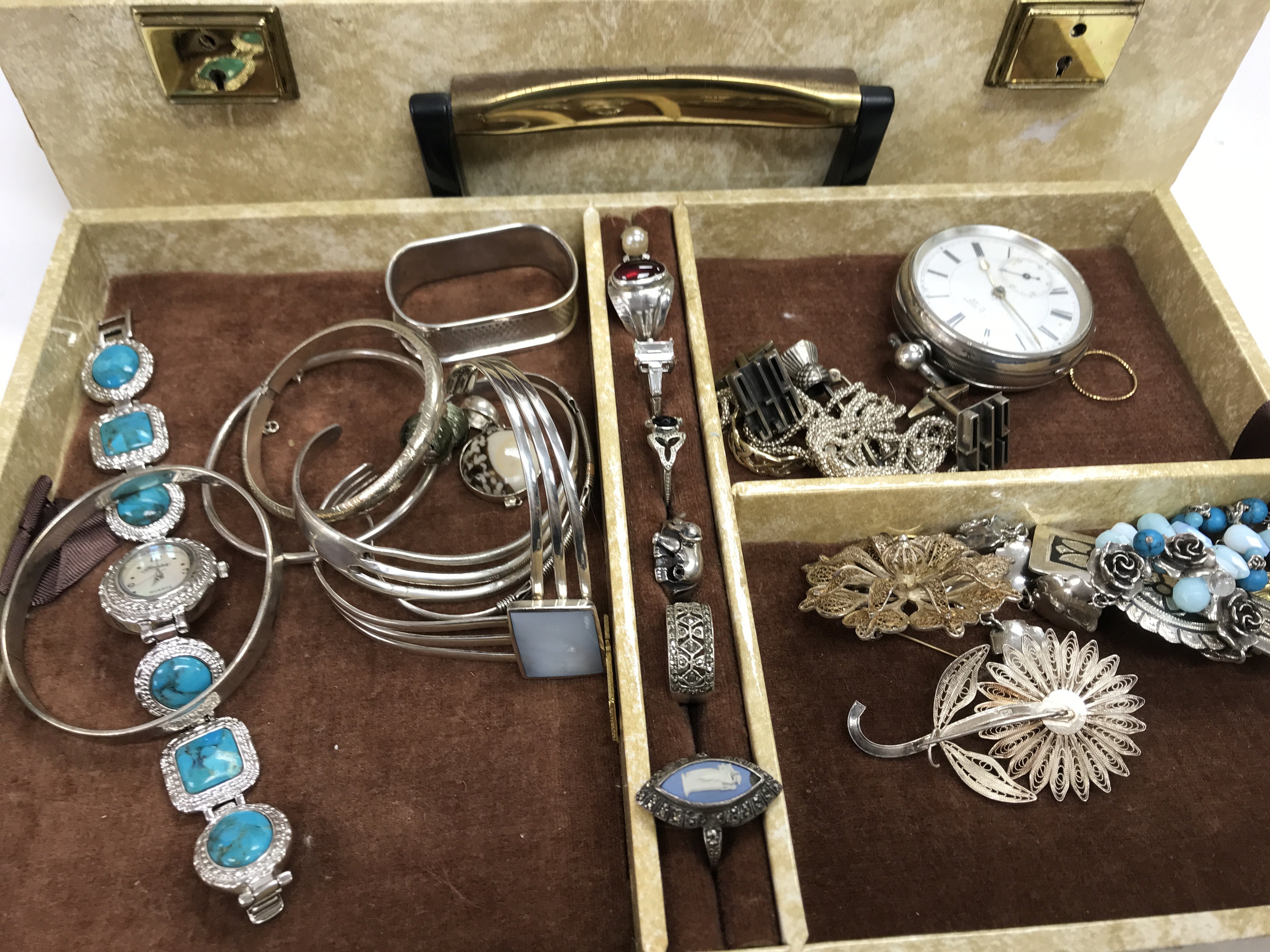 A jewellery box containing a large quantity of silver jewellery