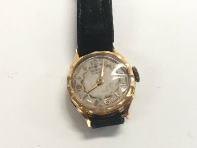 A small 18ct gold cased watch.