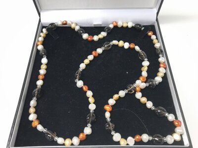 A boxed string of pearls from the pearl company.