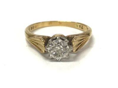 An 18ct gold diamond solitaire ring. Size M and 3.62g.