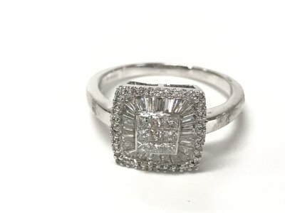 An 18ct white gold square shaped ring set with baguette and round cut diamonds totally approximately 0.86ct. Size S