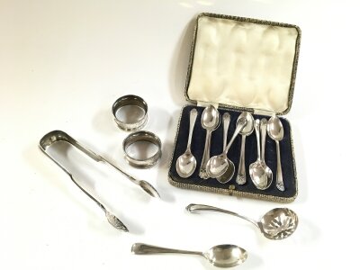 Small collection of silver hallmarked spoons , tongs, napkin rings. 220g total weight