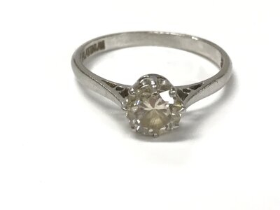 A platinum diamond solitaire ring. Size N 1/2 and 2.97g approximately 0.90ct.