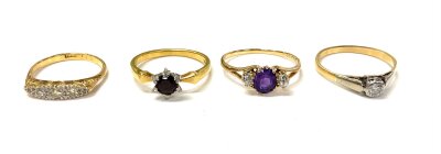 4 vintage 18ct gold stone set rings. Consisting of an edwardian 4 stone old cut diamond ring, 3 Stone amethyst and diamond ring, 18ct and platinum solitaire ring, 18ct platinum garnet and diamond ring. (4), 10.1g total weight.