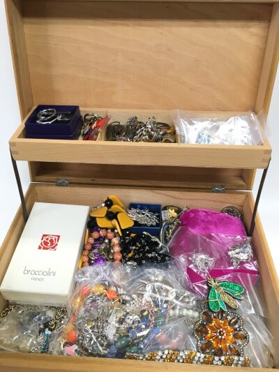 A large box with a tapestry lid , full of good costume jewellery. Bracelets , necklaces, rings , brooches and other