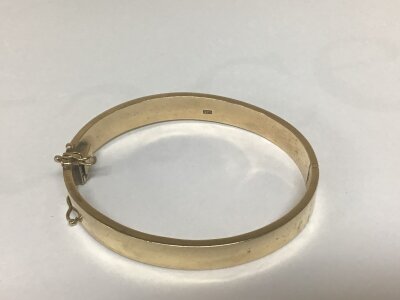 A 9carat gold bangle the interior with personal inscription stamped 375 Total weight 39g
