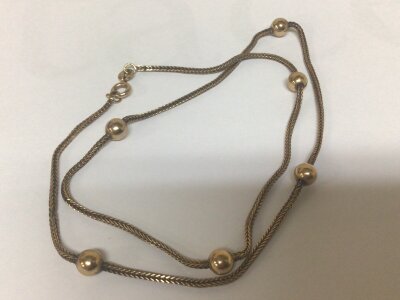 A 9carat gold necklace with gold beads closed link. Weight 7g