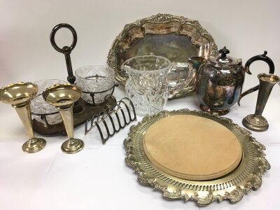 A collection of silver plated items including a three decanter bottle stand, candlesticks, tray, cut glass jug etc.