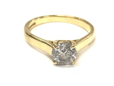 A single stone brilliant cut diamond ring set in a 4 claw cross over setting in 18ct yellow gold. Diamond 0.75ct colour G-H clarity S1 and size J 1/2 approximately. 2.98g