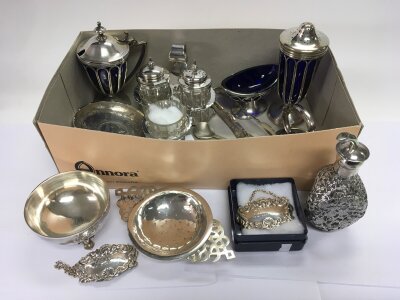 A box of silver and silver plated items comprising spirit labels, cruets etc.