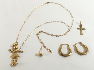 9ct gold jewellery including a figure pendant necklace , pair of earrings , cross pendant, single earring. 3.6g total weight. Also including some non gold pieces as seen in the second photo