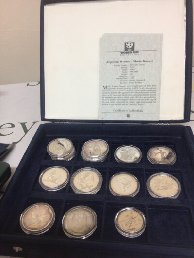 A collection of eighteen silver proof 925 and 999/1000 silver World Cup collection coins mostly one ounce and with some certificates of Authenticity.