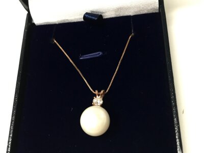 A 9ct rose gold large cultured Pearl and diamond necklace. Diamond approx 0.23ct