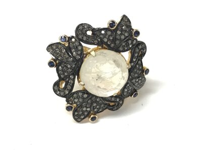 A large silver gilt dress ring set with rainbow moonstone (5.30ct) diamonds and sapphires. Size N