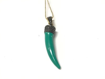 A turquoise enamel tiger tooth style pendant set to the top with old rose cut diamonds in yellow metal on a gold plated silver chain. Diamonds approx 0.33ct.