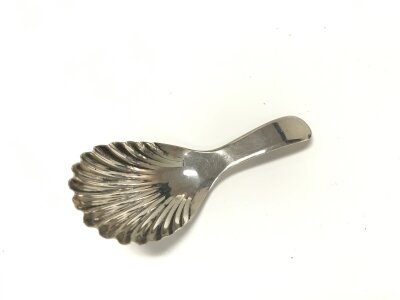 An 1812 caddy spoon possibly by John Smith.