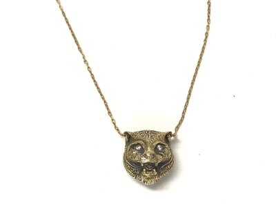 An 18ct gold Gucci tiger necklace. 7.79g