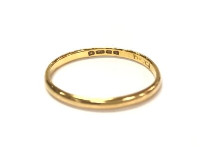 A 22ct gold wedding band. Size N and 1.48g