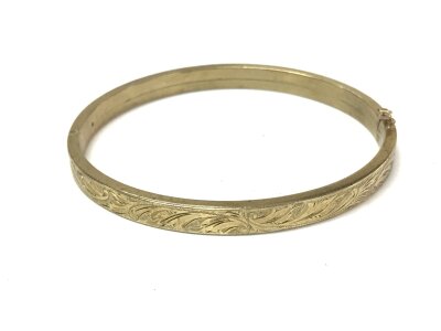 A 9ct gold bangle. 68mm wide, 13.96g