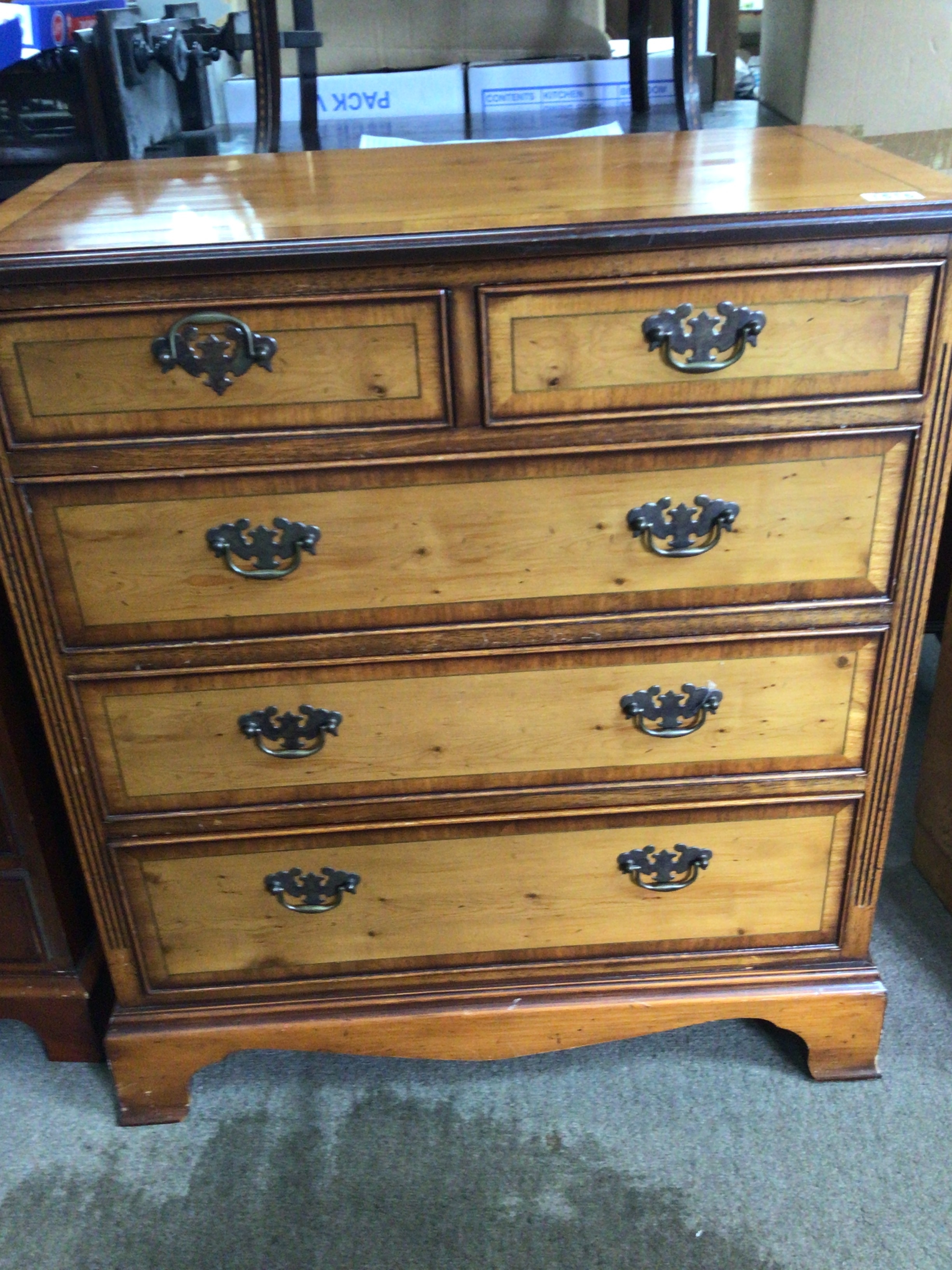 A satin walnut chest of drawers with a crossbanded edge two short and three long drawers 74cmx86cmx41cm