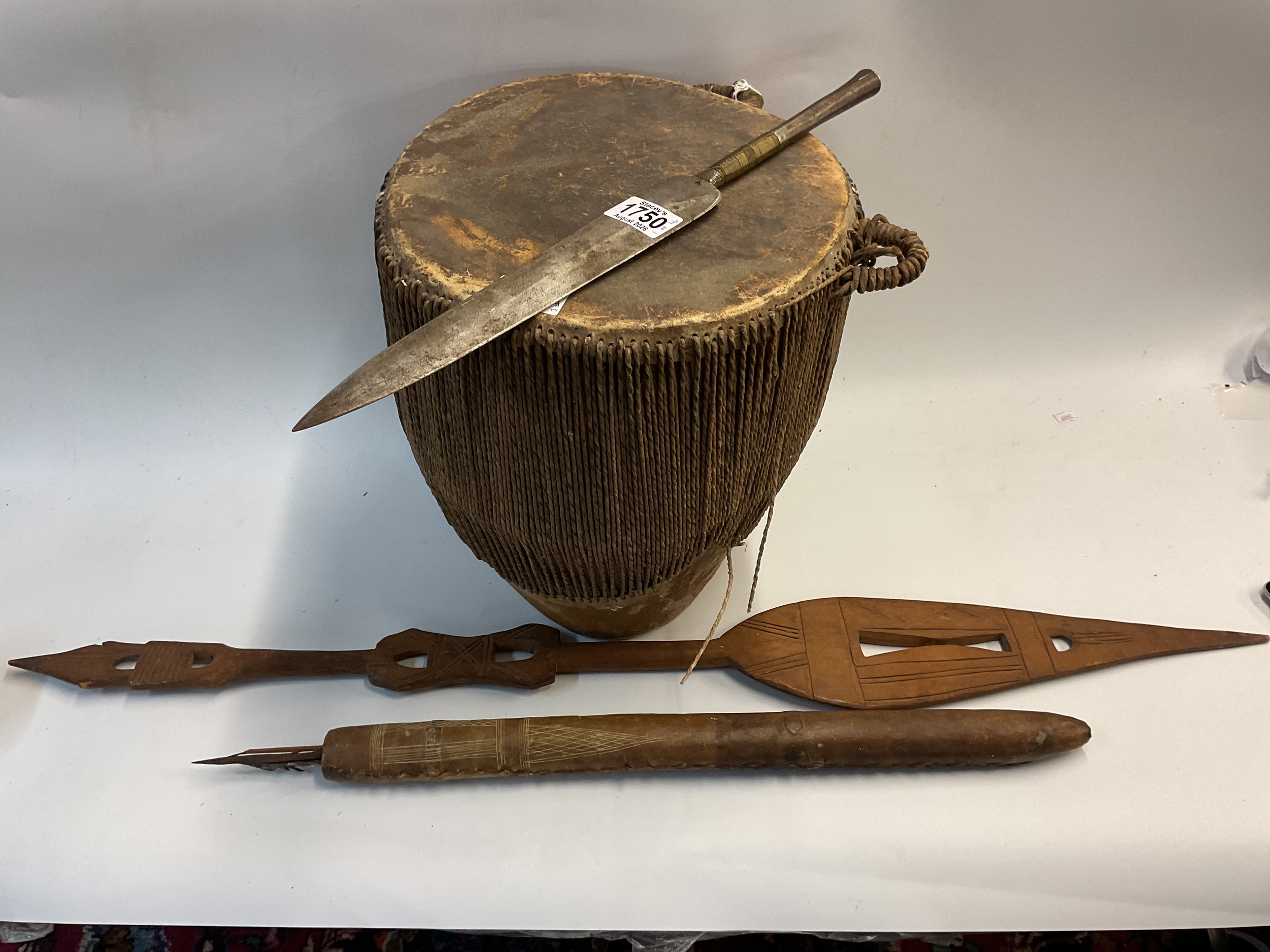 19th c African spear head, hammered metal with fine weaving to the stem along with a drum, paddle and quiver with arrows and blow dart. NO RESERVE