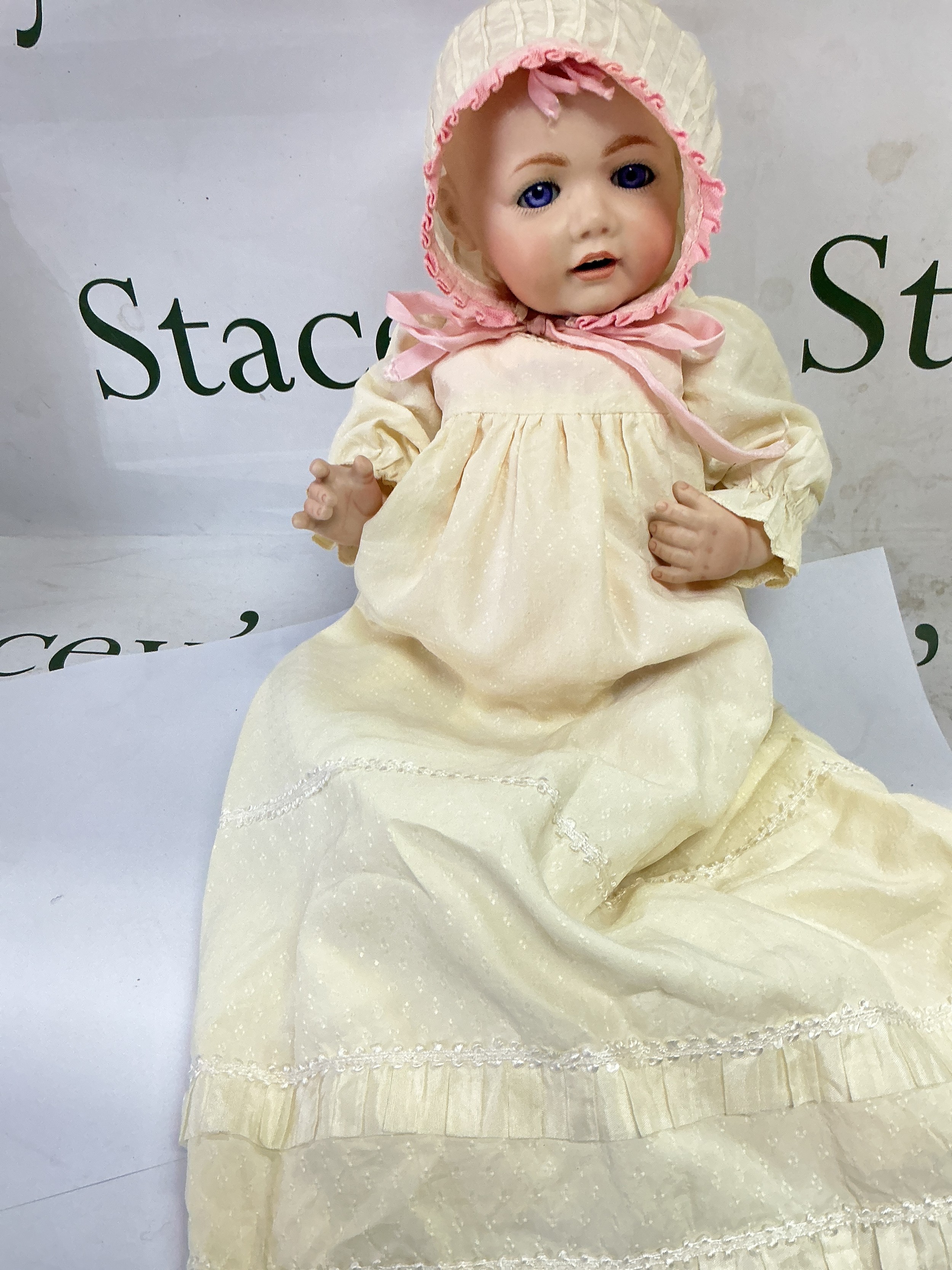 A bisque headed doll, approx length 42cm.  NO RESERVE