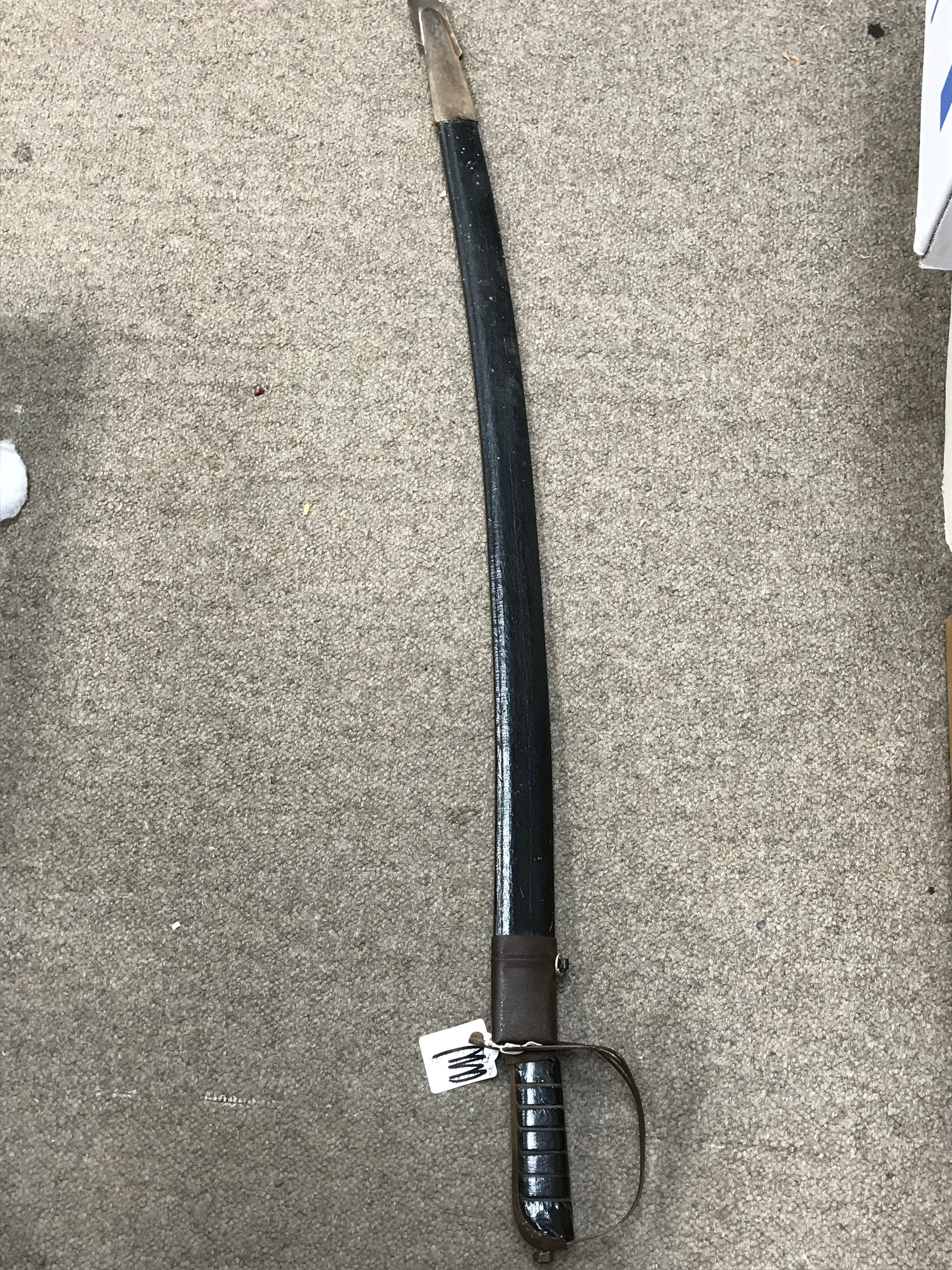 An Indian sword , 86cm long blade 74cm long 
