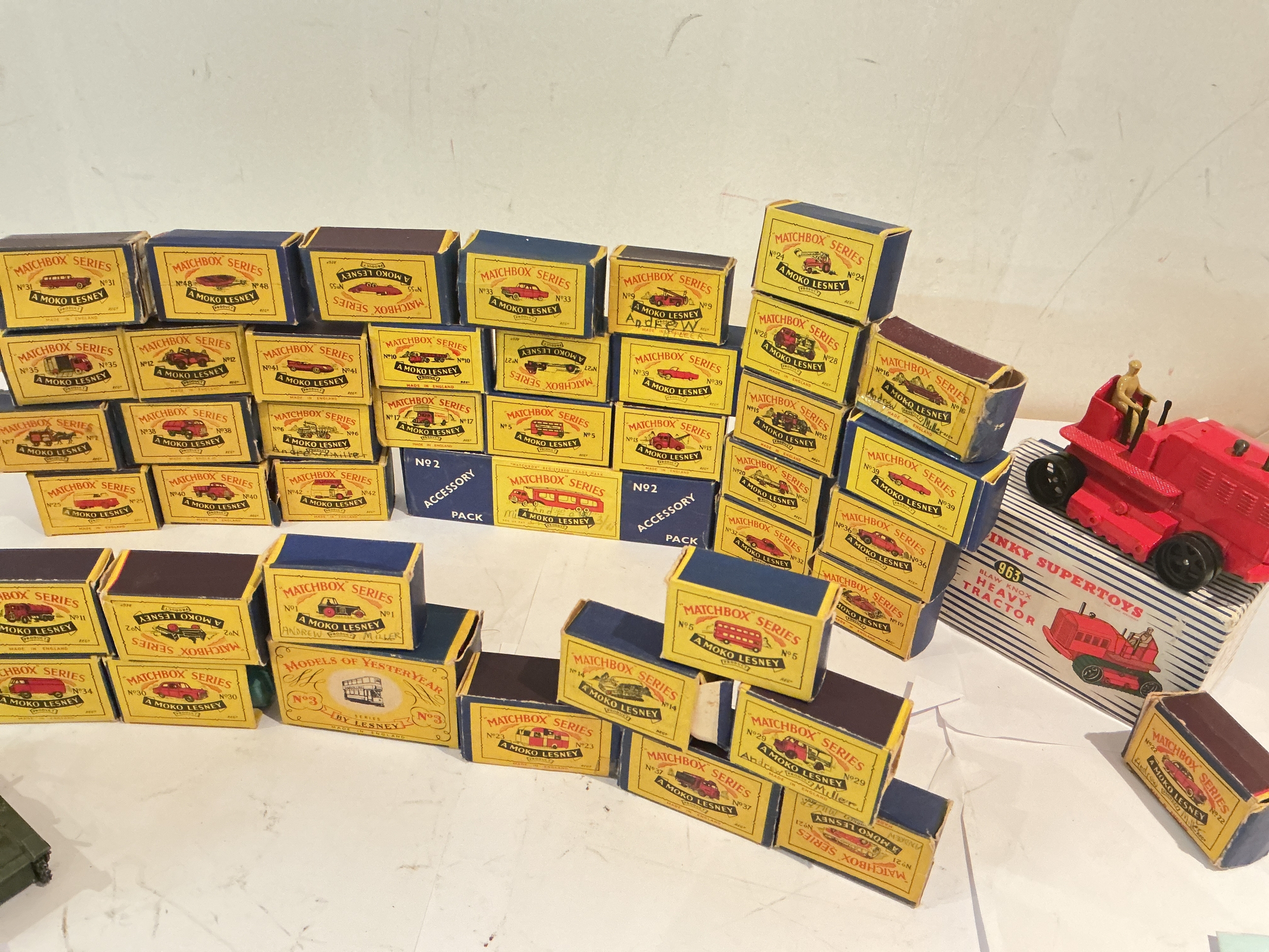 A Collection Of Boxed Early Matchbox Diecast, Boxes In Various States. A Boxed Dinky Heavy Tractor #963 And Loose Playworn.