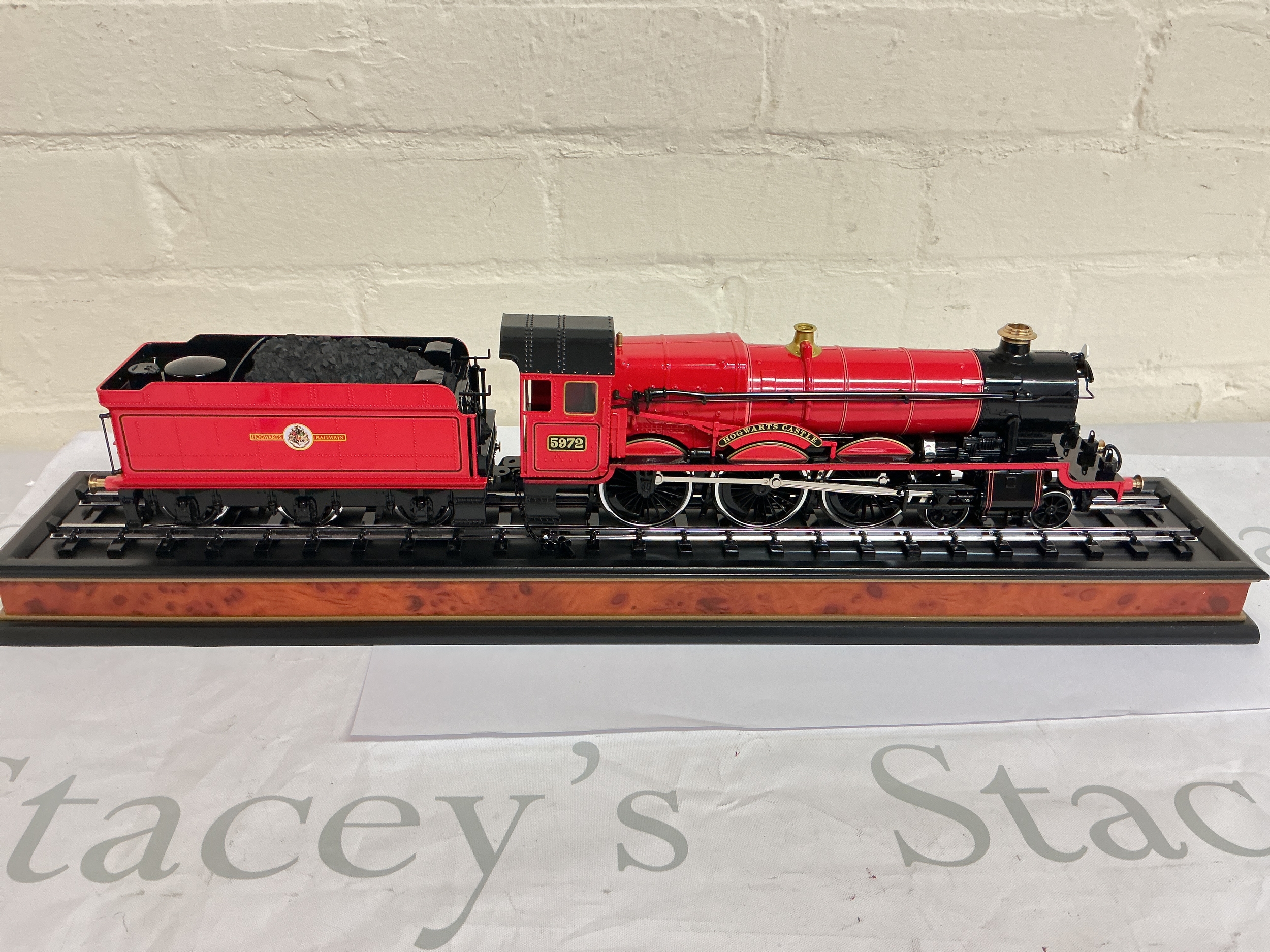 A Noble Collection Hogwarts Express 1/50 Scale on Display Stand.